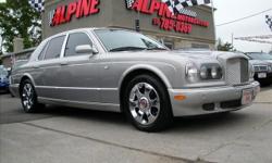 MAGNIFICENT EXAMPLE IN AND OUT!! THIS ARNAGE R IS AS NICE OF AN EXAMPLE AS YOU WILL FIND ANYWHERE!! SILVER TEMPEST FINISHED IN OATMEAL LEATHER WITH LIGHT GRAY CARPETS, BURL-OAK VENEERS, REAR TRAYS, AND TWO TONE LEATHER WHEEL WITH ONLY 36K MILES, CHROME