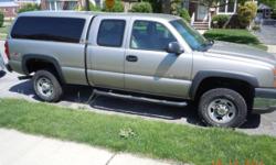 2003 Chevy silverado 2500hd extended cab 4x4 pickup. The truck is a 4 door extended cab short bed truck. It was purchased new by my father who is still currently using it. It has 79617 miles on it, it is the base model with manual door locks, manual