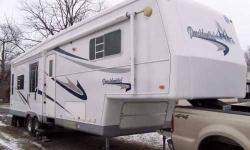 2003 Holiday Rambler Presidential M32RLT 5th Wheel 34 feet Sleeps 4 3 Slide outs Microwave, double sink, 3 burner stove, convection oven, 4 door refrigerator with freezer and ice maker Ceiling fan Ventilation fan with weather control Queen bed Sofa with