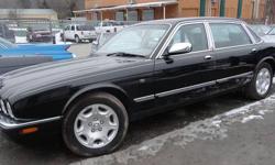 2003 Jaguar XJ8. This car is black with tan leather interior, picnic table in back wood grain all around,looks good runs good real gentlemen car. Please call for address (845)693-4955 we are located in South Fallsburg NY