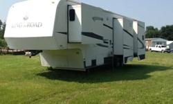 Stock Number: 722617 . 2004 King of the Road 5th wheel camper. Center kitchen layout creates private bedroom and bathroom. Bedroom has slider to create more room with push button retract feature, queen size bed, large 10' closet, built in dressers (10