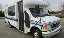 2004 Ford E-350 StarTrans Candidate shuttle bus for 12 passengers w/ wheelchair lift and 4 wheelchair positions. The 6.8L V10 Triton gas motor runs perfectly and starts right up with just 83K miles. The front and rear A/C blow cold and all accessories