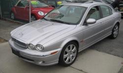 Royal Motors is happy to present this AWD 2004 Jaguar X-Type with State of the art Factory Hands Free Bluetooth System. We'll have you wishing your commute never ends! The Rich Silver Exterior and the Ivory Leather Interior finish gives this Jaguar a