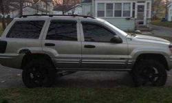 2004 Jeep Grand Cherokee 4x4 The Jeep Grand Cherokee wins high marks for its off road prowess This Jeep has 102,000 miles and is in good condition Exterior color is champagne with a black cloth interior Some standard features include Keyless Entry,