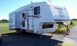 27', 2 slides, queen bed, awning, central ducted heat/AC, lots of storage, island kitchen, 1/2 ton towable,stored inside during winter, nice shape