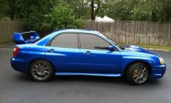 Stunning adult owned WRB 2004 Subaru STI. 104k on the clock. New 2010 Nitride short block installed by Subaru. New water pump installed by Subaru. Newer turbo. Gun metal stock BBS wheels, viper alarm, high end system with GPS, LED color changing round