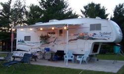 2004 Forest River Wildcat Fifth Wheel Camper. LESS THAN ONE DOZEN ROAD TRIPS!!!!... and in SUPER condition. Sleeps 8 comfortably and must see private bunk room the kids will LOVE!! Also has awesome nifty garage area in rear and plenty of storage! Stove