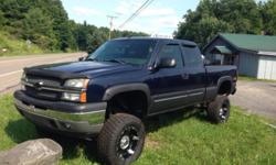 05 lifted z71 one owner with only 80k miles loaded keyless entry 5.3l vortec power windows locks seat diy push 4x4 it has a pro comp 6 inch suspension lift and 3 inch body lift 3/4 ton leaf springs headers k/n cold air kit hypertech programmer moto metal