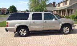 2005 Chevrolet Suburban LT 1500 with 4WD Fully Loaded and a low 101,000 Miles Satin Silver exterior with Tan leather interior Dual front heated 10 way power seats Power windows, locks Tilt, cruise, navigation with disc Rear entertainment system Running