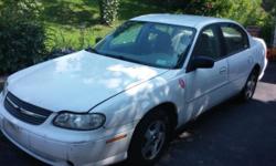 Up for sale is a 2005 Chevy Malibu Classic 4-Door Sedan (White) w/Tan Interior. Engine has low mileage on it - 90,501 original miles. Engine currently starts and runs perfectly. One mechanical problem. Right (Passenger's Side) CV-Axle/Joint went on it a