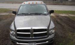 2005 Dodge Ram 2500 in Excellent Condition Quad Cab Grey Exterior Grey Cloth Interior Turbo V6 Diesel Engine with 124,000 Miles Automatic Transmission, Cruise Control All Power Controls Tow Package, Alloy Wheels Keyless Entry, Window Seat Am,Fm and Cd