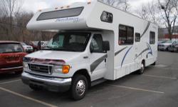 You're looking at a super-clean 2006 Ford E450 Dutchman Express Motor home that's 29 feet long and comes with walk-around rear bedroom with a Queen sized bed, an extra overhead bed, sofa, roomy dinette, full kitchen with fridge & microwave, full bath with