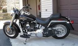 2005 H.D. FLSTF "Fatboy", Always kept in a heated garage: Candy Black Cherry/Metallic Dark Grey; mint condition, low mileage, new tires and brake pads. Custom chrome additions tastefully done. Starts, rides and runs great. Engine modified by "Dyno George"