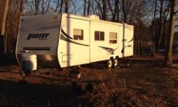 Excellent shape tow behind camper. 31 feet long. 12 foot slide out. Has bunks in back. Microwave installed. Air conditioner and furnace and awning also. Price is firm as camper books at close to $13,000. Serious inquiries only.