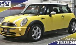 Fun driving and great fuel economy are yours with this sporty and affordable MINI Cooper. This special car is finished in the liquid yellow paint with a white roof and mirrors. It has the highly desirable sport gauges and sport wheels, and the dual pane