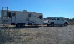 2005 Arctic Fox by Four Seasons Built For Winter Time Travel Trailer It Is 29.9 Feet Long It Sleeps Four Has Everything You Need To Go Camping Or To Live In There is A Queen Size Bed In The Rear With Lots Of Storage Space Has Large Stand Up Shower And Tub