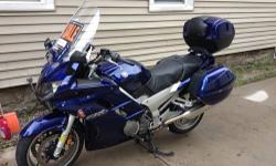 I have a 2005 FJR 1300 ABS, dark blue, with just over 29000 miles.
It has a custom Bill Mayer seat ($600+), highway pegs, oversize windshield (still have the original as well), removable side and rear cases, bar risers and a K&N air filter.
Just put in