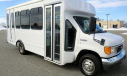 2006 Ford E-350 shuttle bus with 12 passenger seats and 2 wheelchair positions plus driver. It is ready for delivery and has been fully reconditioned and serviced. The powerful 6.8L V-10 Triton gas engine starts right up, runs great and is problem free