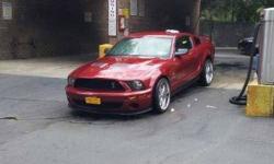 2006 Ford Mustang, V6 automatic, charcoal exterior, black leather interior, 61,000 miles, extended warranty included. Call 516-582-7857.