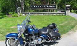 2006 Harley Davidson FLHRCI Road King Classic This Touring cycle currently has 3,450 miles and in great mechanical condition Black Cherry Metallic in color and with a premium Black Sundowner leather seat Equipped with a V2, 4 Stroke 1442.15 cubic