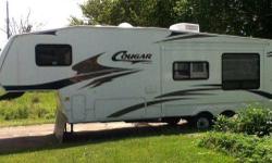 Unit is in excellent condition with 1 slide out.
This is a 2006 Cougar by Keystone. It is a 33ft long 5th wheel camper. Have 5th hitch for it. Fully self contained
INTERIOR FEATURES: Vinyl in kitchen, otherwise carpet throught, Oak Cabinets, Full Kitchen,