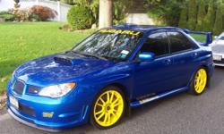 This is a 2006 Subaru STI. Currently it has 74,800 miles. Right now it has the yellow OZ rims with brand new Continental tires on it (225/40/zr18). It also comes with another set of OZ rims (with used tires). It's a stage 2 turbo 330 wheel hp (380