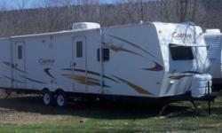 2007 Coachmen M-288 FKS. 13,500BTU central air, 22,000BTU furnace, Microwave, 6 gallon water heater, lp stove, gas/ electric fridge, TV antenna w/ booster, stabilizer jacks, auxiliary battery, 18' awning, upgraded cabinetry, LPG gas/smoke detector, 12'