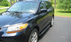 I am the original owner of this excellent condition Santa Fe. Car was always garaged. Liked the car so much that I have purchased a 2013 to replace this one. New tires. Dark blue exterior and gray leather interior. Third row seat, trailer hitch, sun roof,