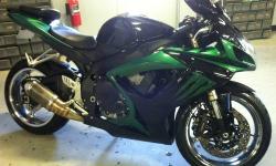 2007 Suzuki gsxr 600 with custom paint and chrome wheels. Has a aftermarket exhaust system, sounds real good. Bike has around 15k. Front forks just serviced, new front tire, rear tire is like new. New rear brake pads. Bike has minor damage on left side in
