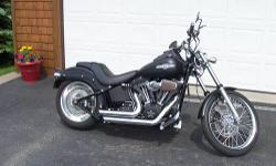 ONE OWNER,I PURCHASED NEW.ONLY 2,100 MILES.BIKE IS FLAWLESS-ALWAYS GARAGED AND DRY,NO SCRATCHES OR CORROSION.FACTORY DENIM BLACK,1584CC,6 SPEED,UPGRADED FACTORY WHEELS WITH 200MM TIRE.VANCE AND HINES EXHAUST,HD HEAVY BREATHER,2 INCH REAR LOWERING KIT BY