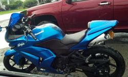 Has new right fairing,a passenger seat as well as a matching back cover for when you want to ride solo,like new front and back tires (less than 1200 miles on them),new front head light bulb, custom performance exhaust (Two Brothers pipe),new front
