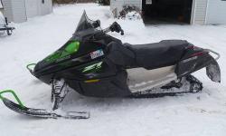 I am selling my 2009 Arctic Cat Z1 LXR and a 2 place Triton clamshell trailer, an XT11. Both were purchased prior to the season in 2011. I have decided to concentrate on skiing as my winter activity and have had no time to use the sled. This winter is