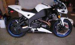 2009 Buell XB12-R. pearl white and neon blue. I bought this bike new and it's still like new w/ only 2000 some miles on it. never wet - never down. adult owned. stored in heated storage since new. this bike is new. meticulously taken care of. not a