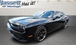 Check out this 2009 Dodge Challenger SRT8. It has a transmission and a Gas V8 6.1L/370 engine. This Challenger comes equipped with these options: Rear courtesy lamps, Leather-wrapped steering wheel, Sentry Key theft deterrent system, Universal consumer