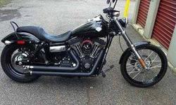 2010 Harley Davidson Dyna Wide Glide FXDWG The new Wide Glide is a Dyna Big Twin done up old school chopper style A low, stretched out custom with drag bars and forward foot controls that give its rider a real fists in the wind profile The LED stop, turn