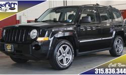 Jeep Patriots are incredibly popular here due to the combination of great fuel economy, roomy interior, classic Jeep styling, and go anywhere four wheel drive. This Patriot shows well with its shiny black paint and white letter tires. Take this one out