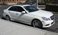 A beautiful meticulous & fully loaded one of a kind with the Premium 1 Package E350 Sport model in Artic White and Almond/Black interior with added Rear Window Spoiler, Trunk Spoiler, and complete headlights, rear view mirrors, tail lights, AMG grille and