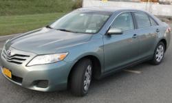 Great Aloe Green Toyota Camry with light gray interior. Car serviced at Toyota dealer regularly with all records available.