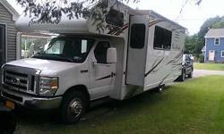 Stock Number: 704738. Like new, u-shaped dinette, flat screen tv, oven, stove top, microwave, generator, bike rack, back-up camera, air conditioner, low mileage, stored inside for winter months, 4000 miles on Ford E-450 Super Duty, A/C, sleeps 6. Call