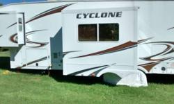 This is an amazing Toy Hauler that is in mint condition. Have to sacrifice, must go don't want to sell but have to. It has a 32 inch TV stereo system in and out , has a good generator, queen size bed and queen bunks, great 5th wheel we are leaving state
