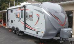Heartland 21' Camper. Model Edge M21. 2011 used two times. Like new condition. Winter cover comes with it. 3500 lb Easy to tow. One slide, Original Owner, No smoking, No pets. INTERIOR: Vinyl Floors, Oak Cabinets, Full Kitchen, Dinette, Top/Bottom Fridge,
