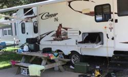 The Camper Was Used 5 Times And Was Kept In Immaculate Condition. It Has A Slide Out Living Room And Kitchen, Electric Awning, Indoor /Out Door Stereo, Outdoor Sink, Sleeps 11 People. It Also Has All Appliances, Large Kitchen Table Seats 6 Master-bed Room