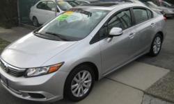 Royal Motors is happy to present this 2012 Honda Civic EX-L Navigation. We'll have you wishing your commute never ends! The rich Silver Exterior and the Gray Leather Interior finish gives this Honda a sleek and sophisticated look. Drive this Fully Loaded