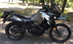 Black/graphite, 3,600 on road-only easy miles. Sargent seat, Givi tinted windscreen. Stock seat and windshield included. 12 volt receptacle in upper fairing. Otherwise stock machine ready for add-ons.