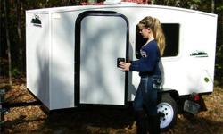 Kristi Trailer, less than one yr old. Custom interior for tools (easily removable). Man door on side w/barn doors on back. 4 yrs left on mfg. warranty.