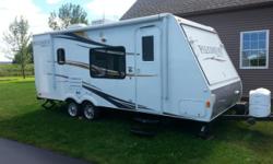 Clean 2012 Palomino Stampede 238 travel trailer. When you purchase a hybrid travel trailer, you will have a lot more room inside then you would expect. Open up the 2 end bunks with 2 queen beds and you will have a wide open living room/kitchen area .This