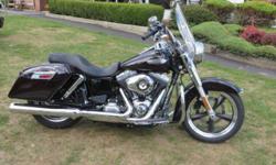 Easily convertible from cruising to touring, it's like two bikes in one. The 2014 Harley-DavidsonÂ® DynaÂ® Switchback? FLD model with detachable saddlebags and windshield is perfect for both cruising and touring. It's like having two bikes in one. It sports
