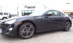 Check out this 2015 Scion FR-S . It has an Automatic transmission and an I4 2.0 L engine. This FR-S has the following options: Electronic Stability Control (ESC), Glove Box, Rear-Wheel Drive, Black Side Windows Trim, Tailgate/Rear Door Lock Included