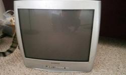 Selling a 21 inch Magnavox television, in good shape, but does have a small scratch/crack toward the bottom of the screen and some dings on the side (see photos). Has a lot of life left in it - does not have a remote - would work well for a guest room or