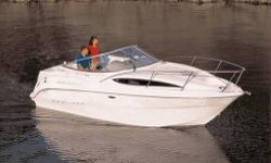 The Bayliner 2455 Ciera family cruiser features a roomy, one level cockpit with L-shaped seating that converts to a sun lounge (the Sun Chaiser seat), an enclosed head with a shower, a mid cabin private berth, and larger fuel / water capacity to get